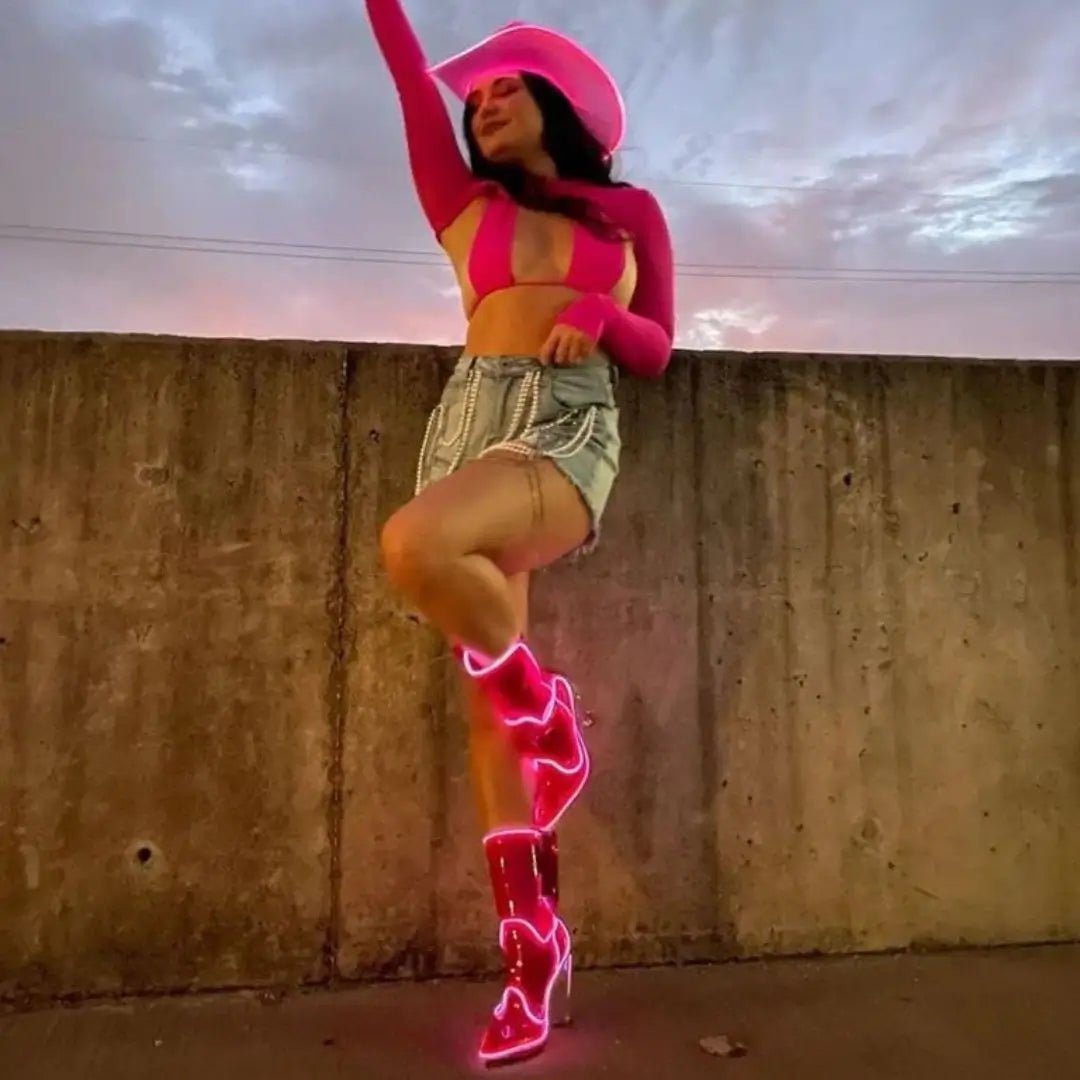 Customer Brianna T dancing in pink cowgirl hat and boots